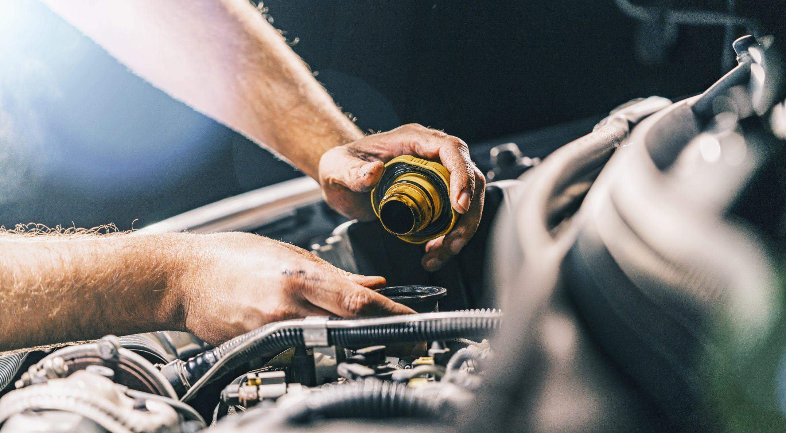 Hand mechanic in repairing car,Change the Oil